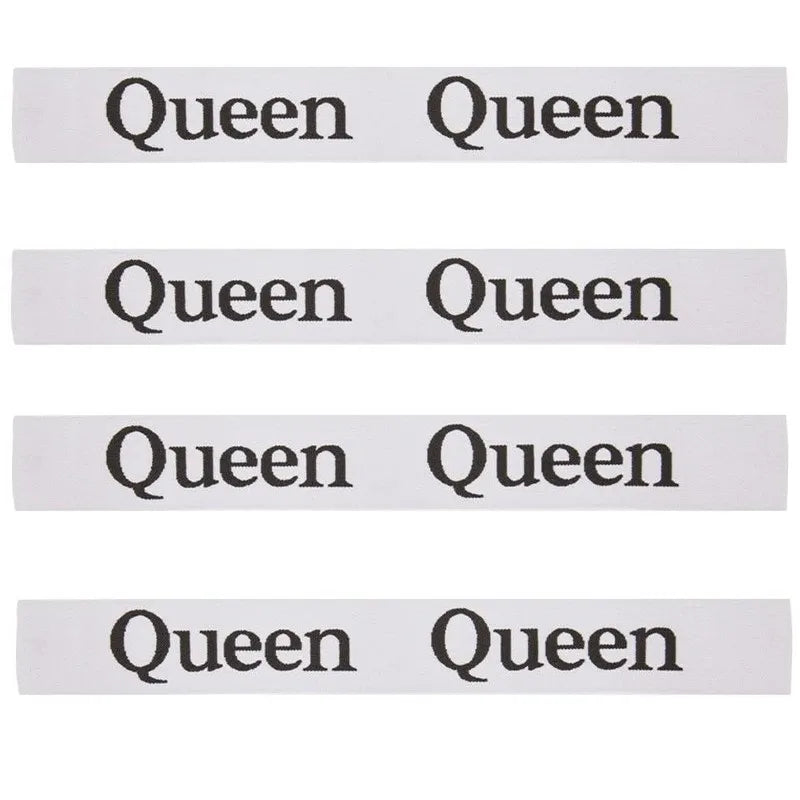 A set of four white elastic straps with the word Queen printed on each.
