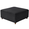 Black stretch jacquard ottoman and stool cover with a textured fabric.