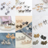 A collection of silver and gold adjustable waist clip brooches for garment decoration.