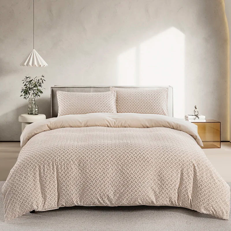 A beige boho tufted microfiber duvet cover set displayed on a bed with natural light.