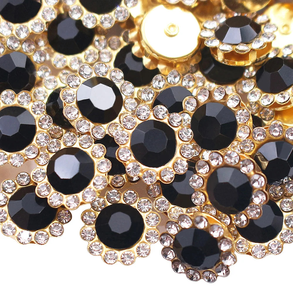 Close-up of gold and black crystal rhinestone sew-on buttons arranged in a floral pattern.