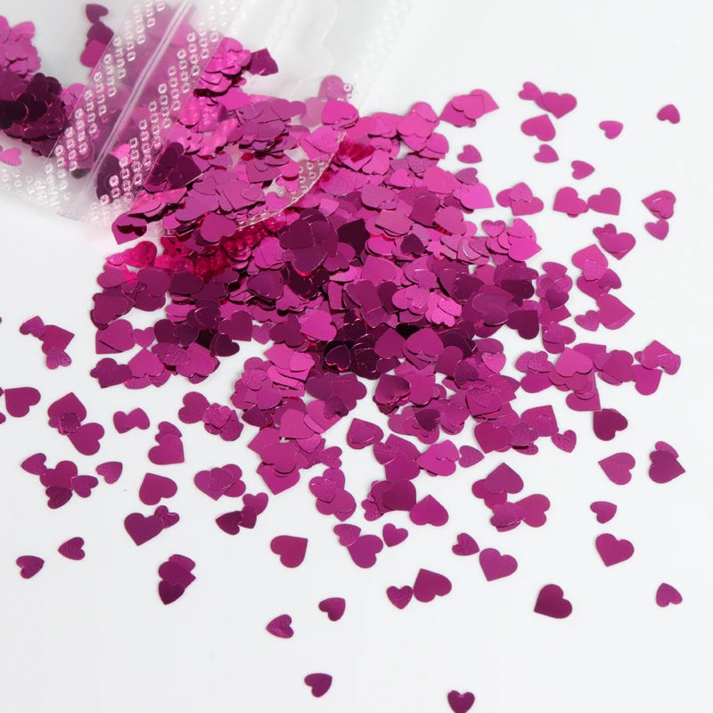 A pile of sparkly magenta resin glitter filler for epoxy art