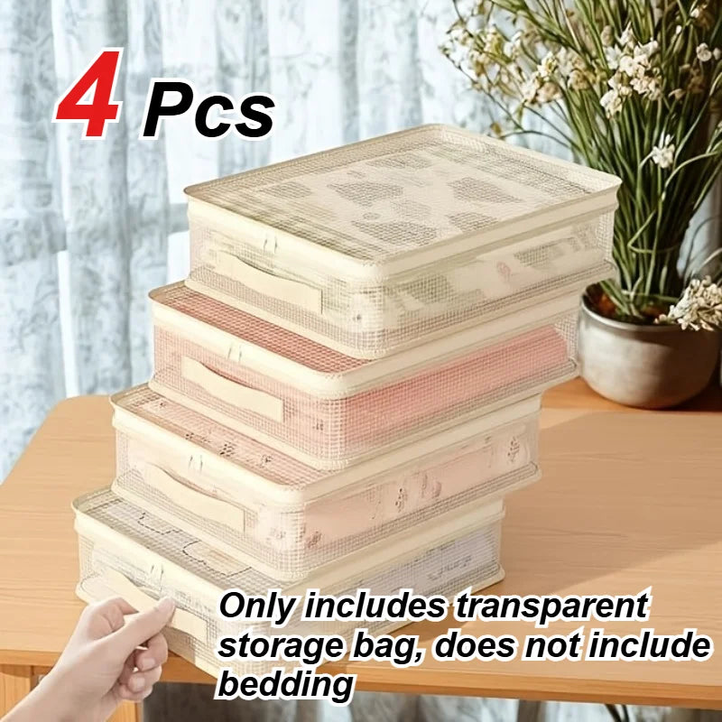 Four stacked clear storage bags for bedding and blankets shown on a wooden surface.
