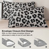 Two leopard print decorative pillow covers with an envelope closure design shown on a light surface.