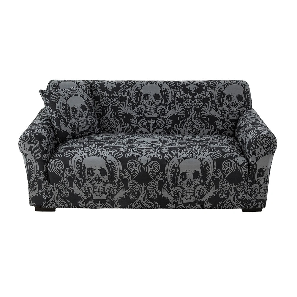 A black stretchable festive sofa cover with an ornate skull and floral pattern.