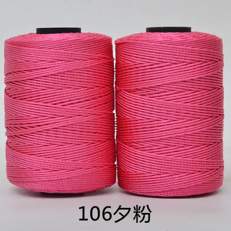 Two pink hand knitting and crochet cords wound on spools, labeled 106 strands.