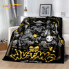 A black and gold graphic throw blanket featuring a fierce warrior design with stylized text.
