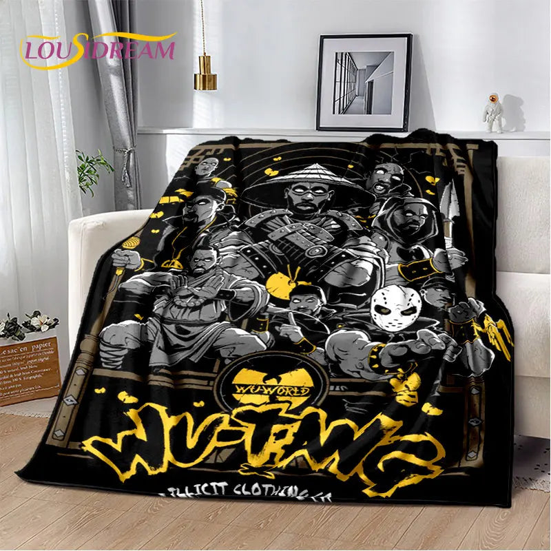 A black and gold graphic throw blanket featuring a fierce warrior design with stylized text.