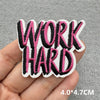 Black and pink embroidered patch with the text WORK HARD