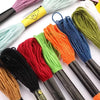 A collection of premium multicolor embroidery floss threads in various colors like red, orange, green, and blue, displayed on