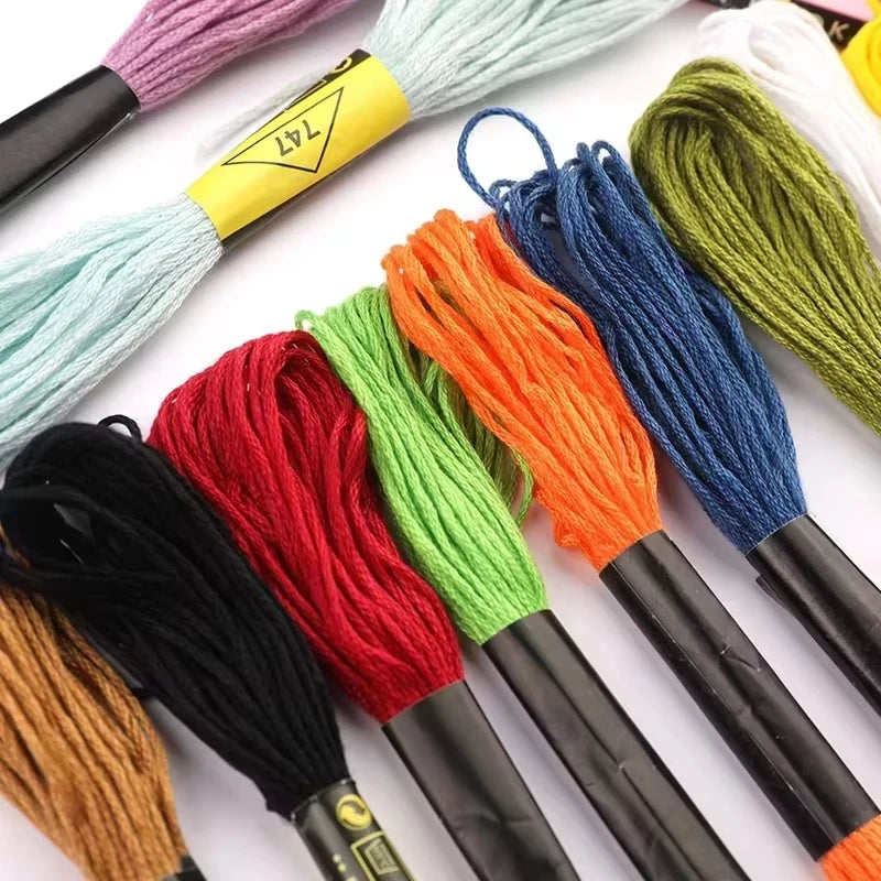 A collection of premium multicolor embroidery floss threads in various colors like red, orange, green, and blue, displayed on