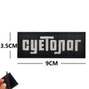 Black embroidered patch featuring the text cyetonor with white stitching and dimensions.