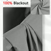 A close-up view of a gray blackout curtain fabric with a gathered texture and a rolled section.