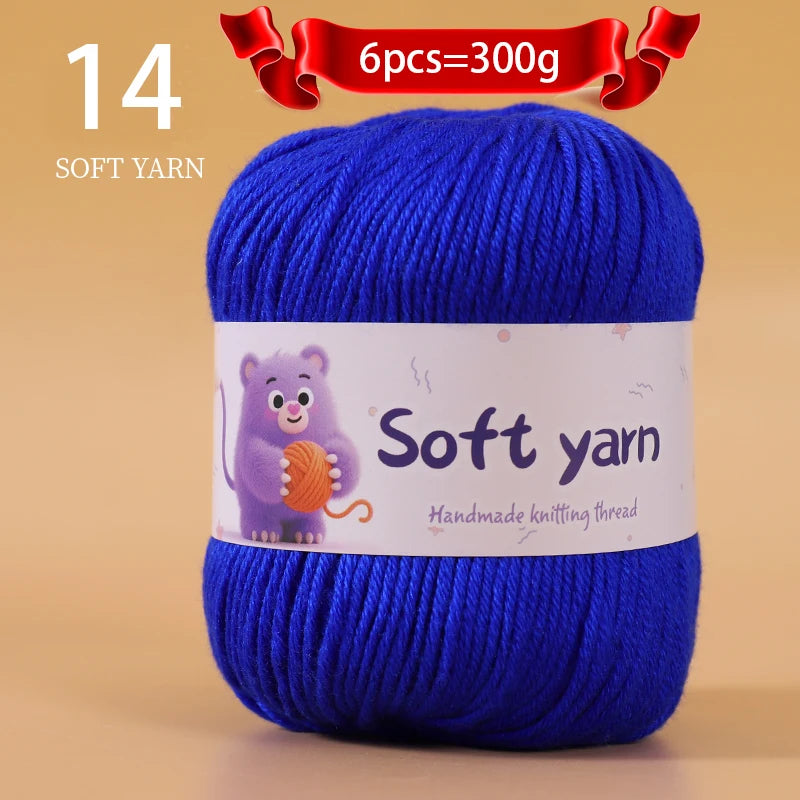 A skein of 14 soft blue yarn is shown with a label indicating 6 pieces equal 300g.