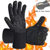 Black heat resistant BBQ and oven gloves with non-slip silicone grip shown against a fire background