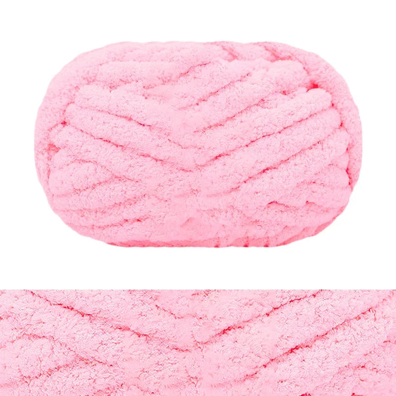 A pink hand-knitted wool finger line scarf in a textured knit pattern.