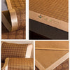A close-up view of a natural bamboo cooling mat with a tan fabric and leather trim.