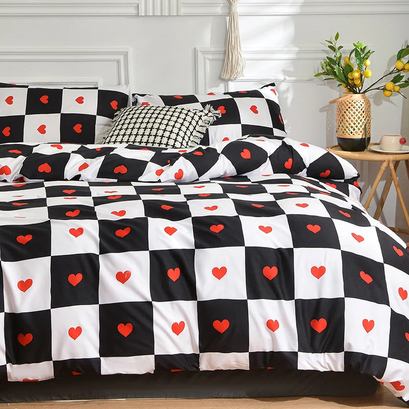 Black and white checkered duvet cover set with heart patterns and pillows on a bed.