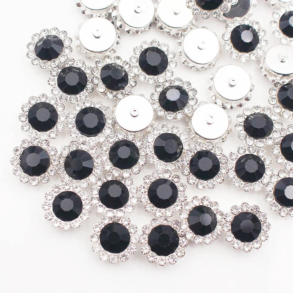 Silver and black crystal rhinestone sew-on buttons arranged in a floral pattern