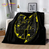 Black flannel throw blanket featuring a large yellow stylized letter N design