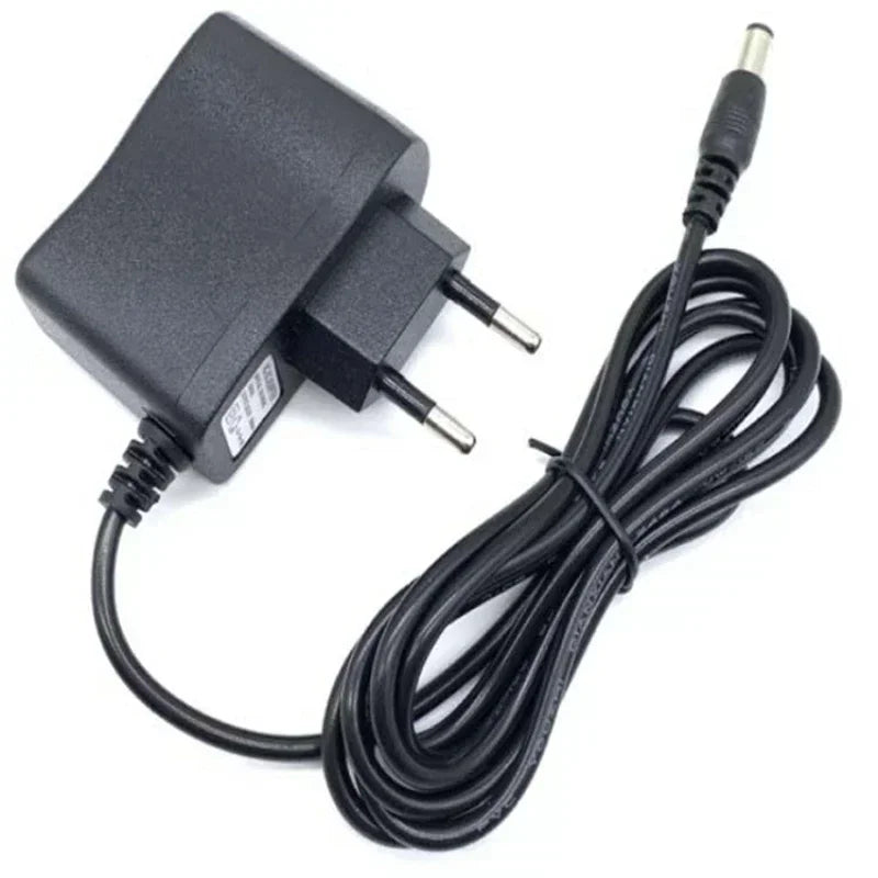A black portable handheld sewing machine with an attached electrical cord and plug.