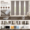 Set of four linen look blackout curtains with stainless steel grommets shown hanging in a window.