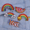 Rainbow letter patches featuring the words Love is Love and Sugar on a denim jacket