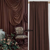 A close-up of a dark brown stretch fabric curtain draped elegantly in a room setting.