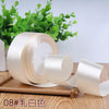 Roll of 4 cm wide satin ribbon in ivory color for gift wrapping and DIY crafts