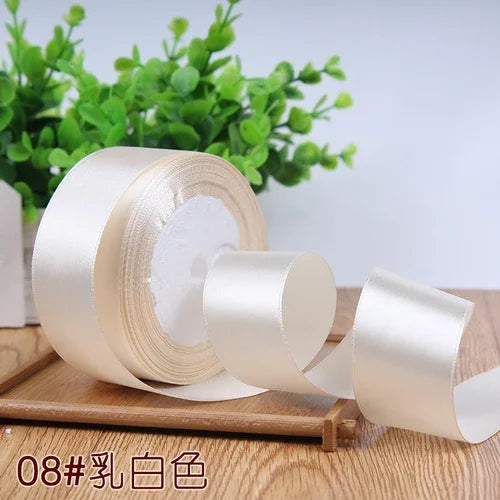 Roll of 4 cm wide satin ribbon in ivory color for gift wrapping and DIY crafts