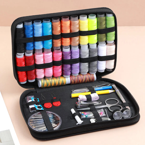 A black zippered pouch containing various colored threads and a complete sewing kit with tools like scissors and needles.