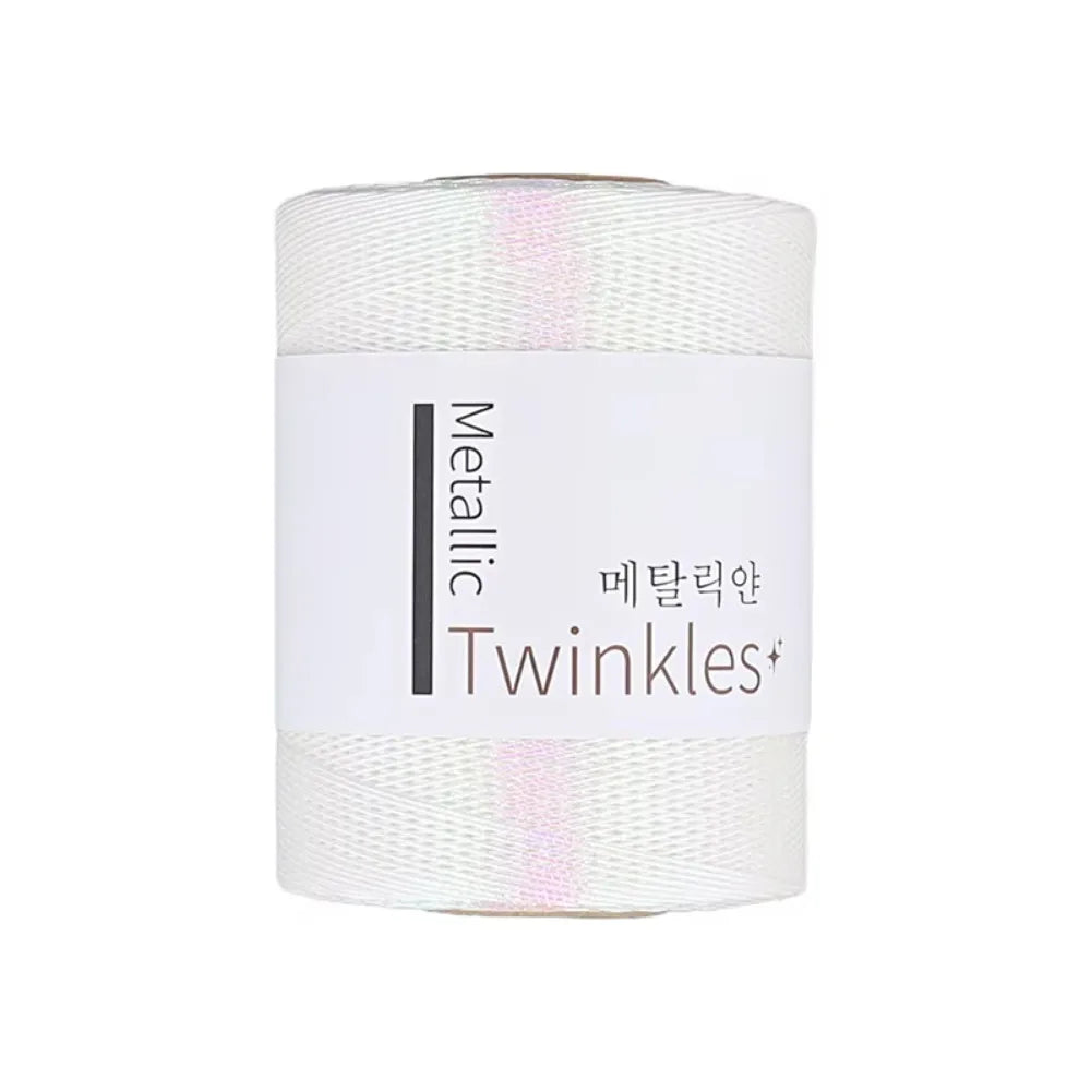 Roll of metallic twinkles yarn with a white background and Korean text
