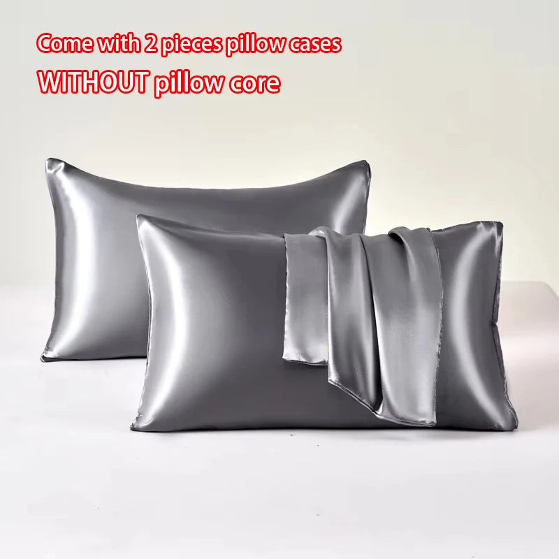 Two smooth satin pillow cases without a pillow core displayed on a white surface.