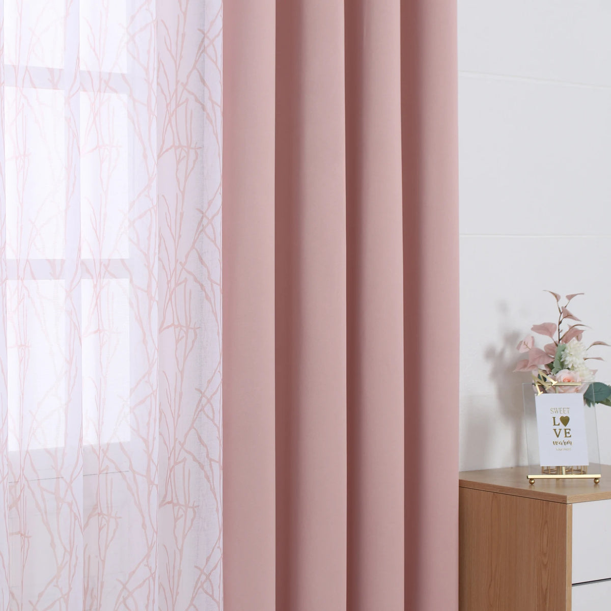 Pink linen curtains featuring sheer and blackout drapes in a soft blush tone.