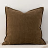 A solid brown chenille throw pillow with a slightly pointed shape.