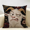 A dark floral cushion cover featuring a realistic, screaming goat face in light gray fur.