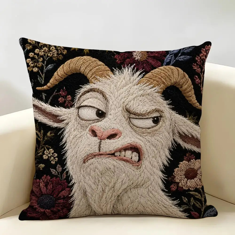 A dark floral cushion cover featuring a realistic, screaming goat face in light gray fur.