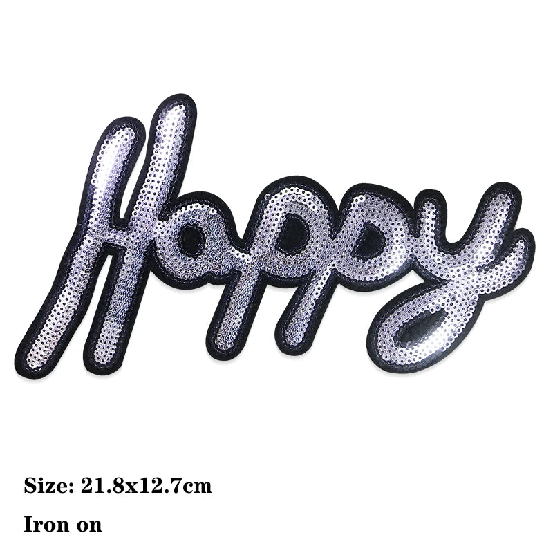 Iron-on patch featuring the word Happy embroidered with silver and black sequins