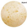 A round, light beige blanket or throw with a speckled texture labeled Style-6.