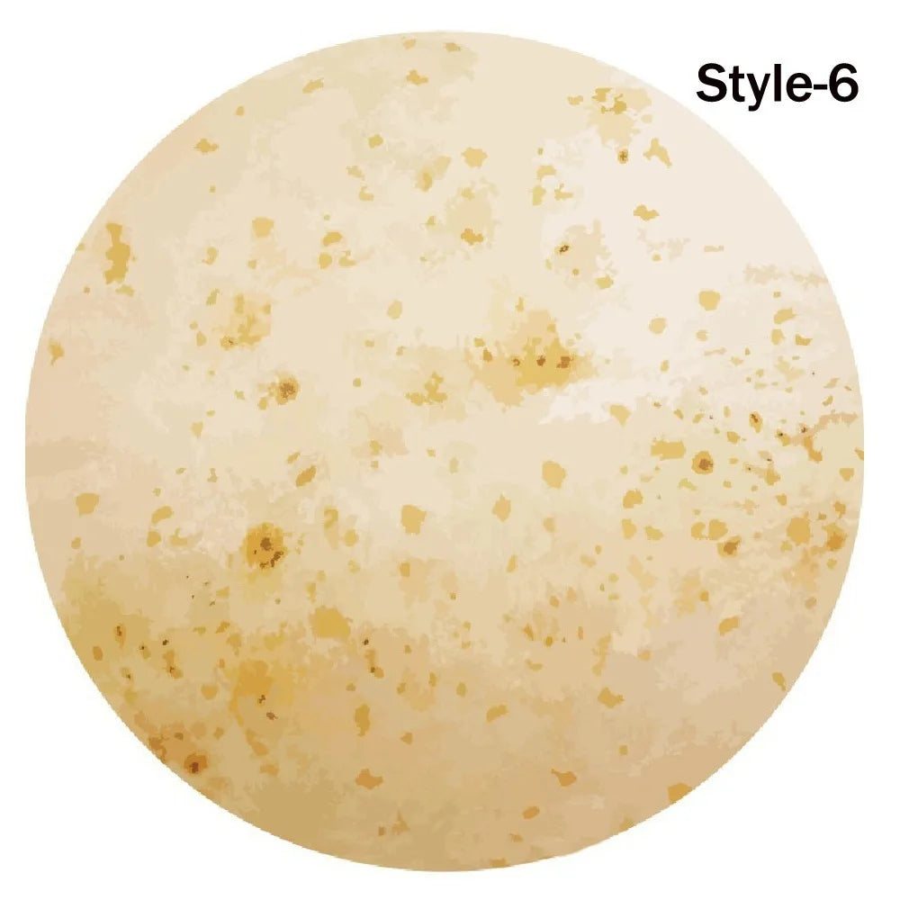 A round, light beige blanket or throw with a speckled texture labeled Style-6.