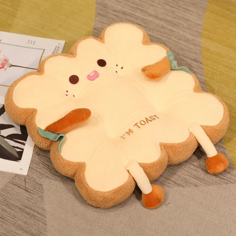 A plush cartoon toast shaped seat cushion with orange feet and a light yellow body.