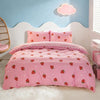 Pink strawberry print duvet cover set displayed on a white bed with a cloud-shaped light fixture.