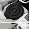 Interior view of a car seat showing a rotating cushion and steering wheel controls.