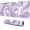 A purple and pink marbled art vortex mouse pad with a non-slip rubber base.