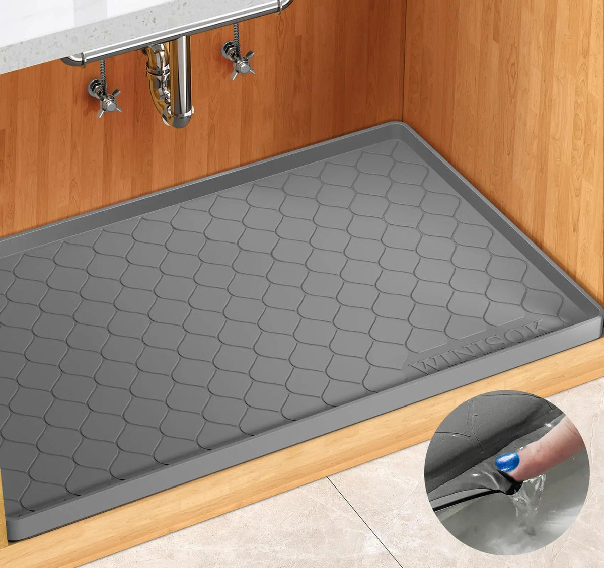A silicone under sink cabinet liner installed in a wooden cabinet, showing its textured surface and installation.