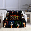 A black printed flannel travel blanket featuring various stylized faces and the word KISS