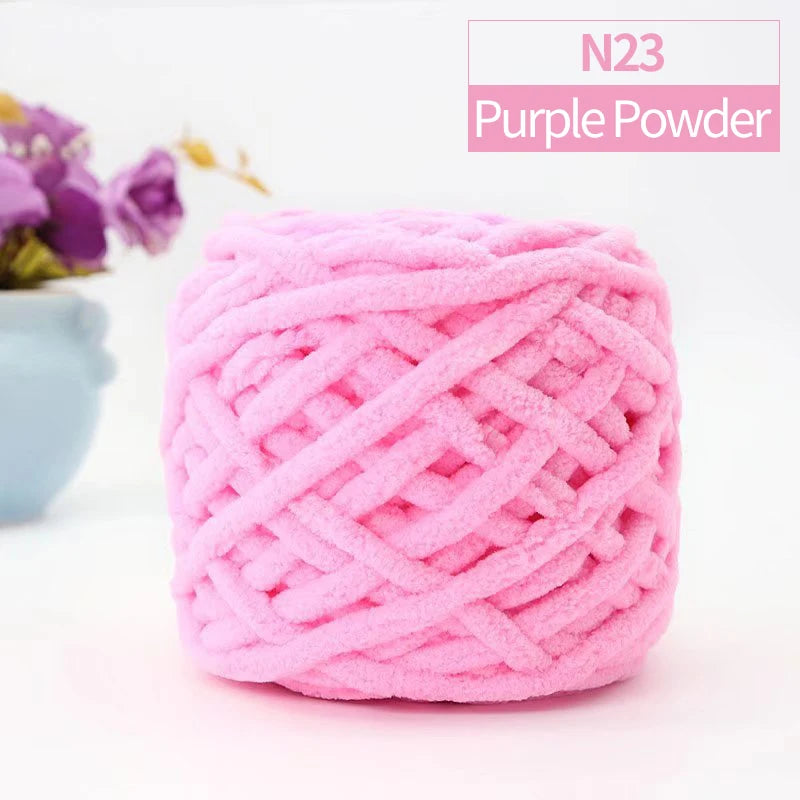 A ball of pink purple powder knitting yarn labeled N23 Purple Powder
