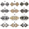 A collection of twelve vintage swirl clip brooches in silver and gold tones.