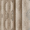 A close-up of a beige and gray European style sheer jacquard curtain panel with an ornate floral pattern.