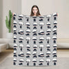A gray flannel throw blanket featuring repeating characters from Jujutsu Kaisen, including Gojo Satoru.